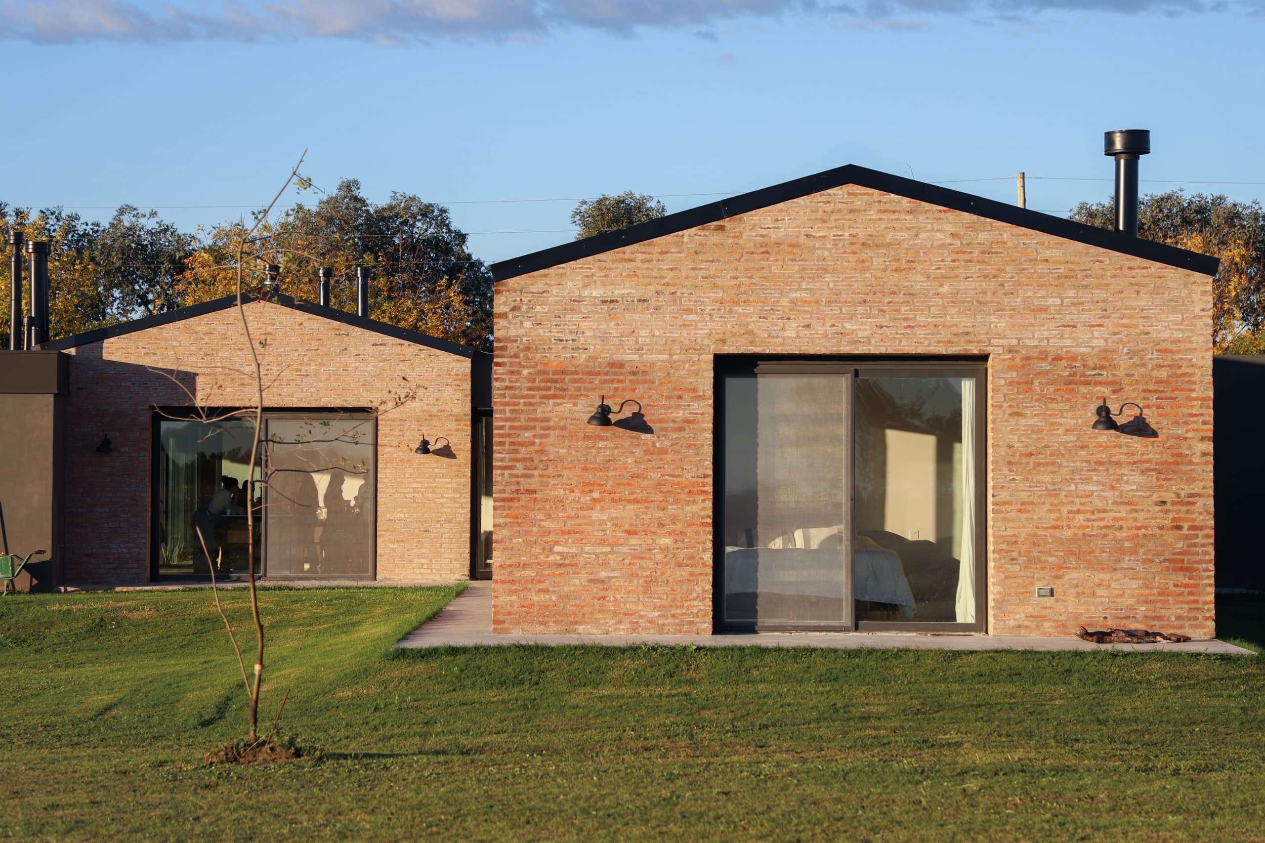 Contemporary brick house with large glass windows and modern design